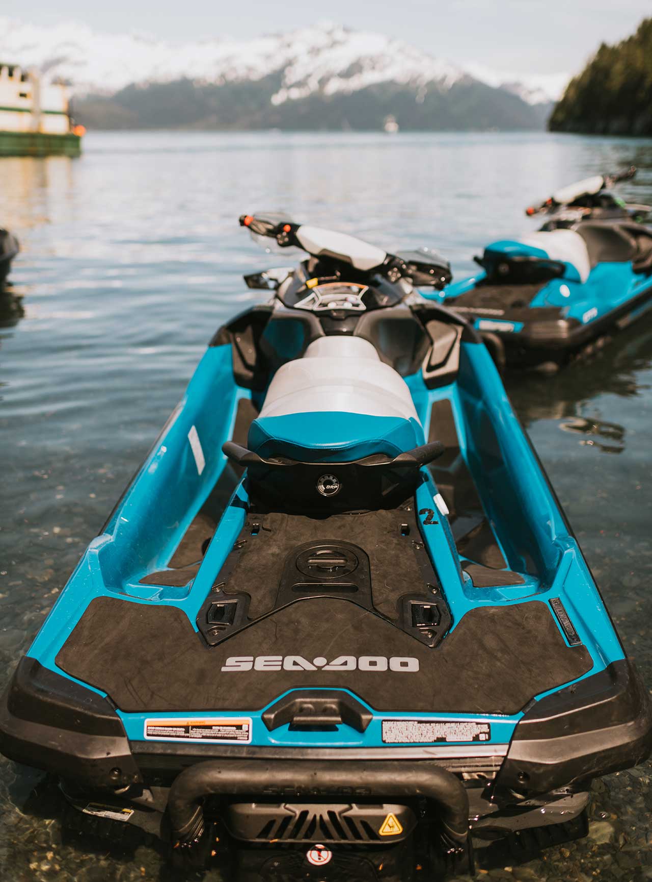 Blue Jetski Cockpit with view of Lake and Snow Capped Mountains in the Background