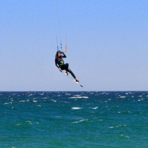 A woman Kitesurfing