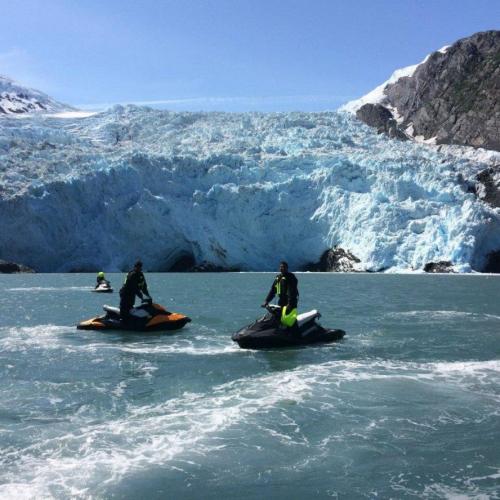 Jet skiers and Glacier in Alaska