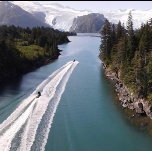 Jet skiers ride through Blackstone bay Alaska